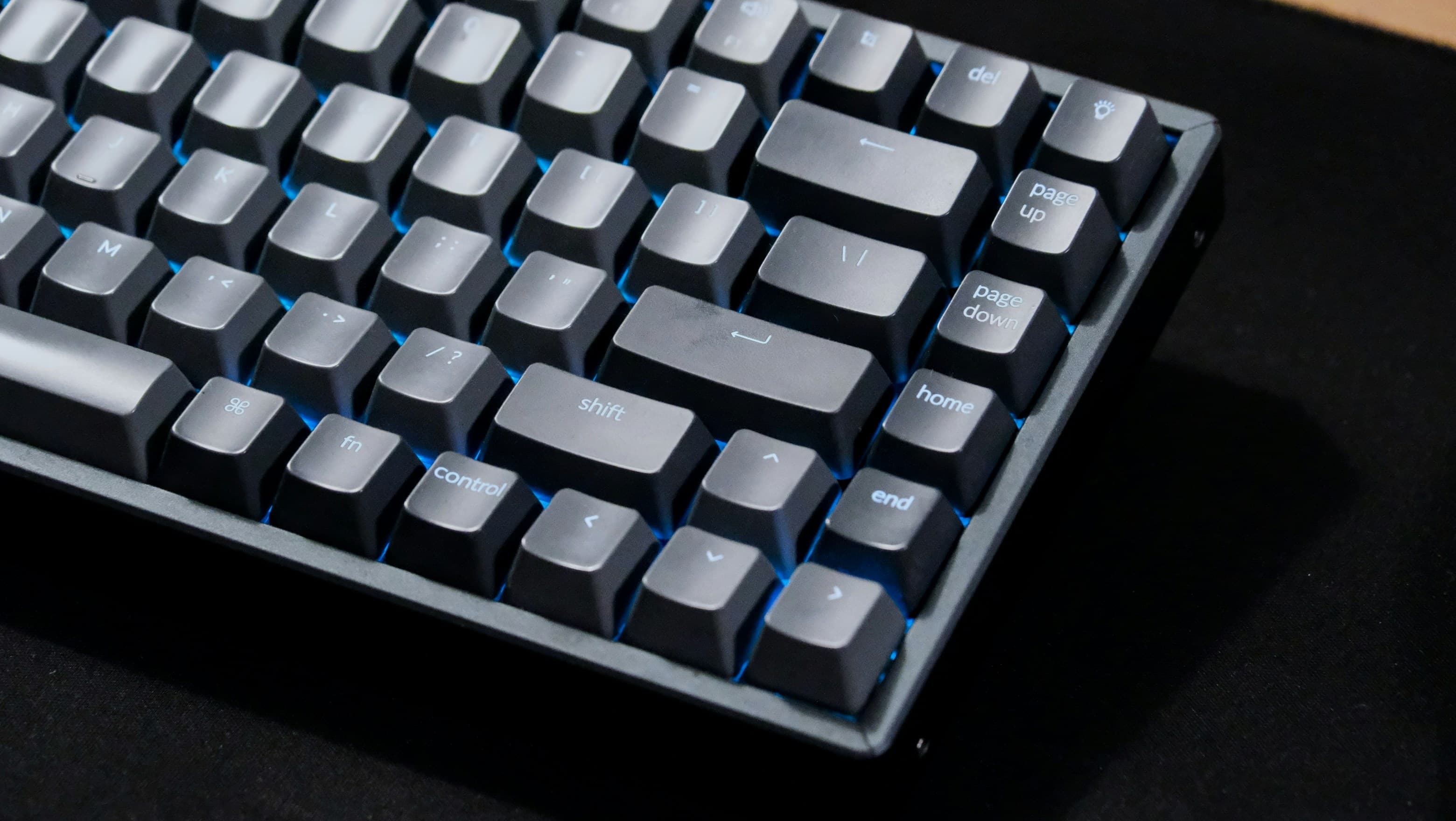 The right half of the same keyboard at a low angle, showing the navigation column